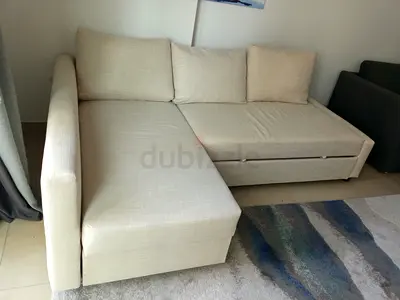 Light beige L-shaped fabric sofa with storage - good condition