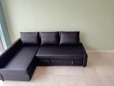 Black L-shaped Faux Leather Sofa with Storage - Good Condition