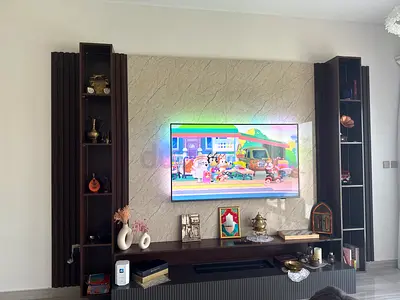 TV wall unit with built-in shelving