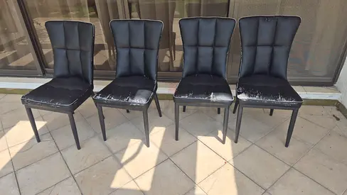 Set of 4 black faux leather dining chairs with light wear