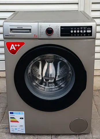 fully automatic 7kg Hoover brand washing machine, perfectly working condition, color is silver.
