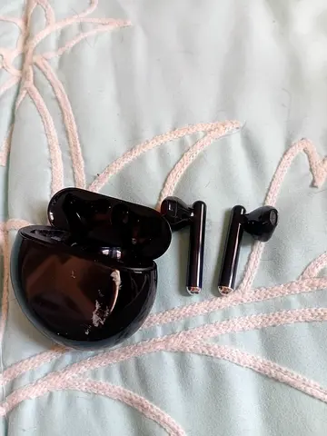 Used black true wireless earbuds with charging case - working condition