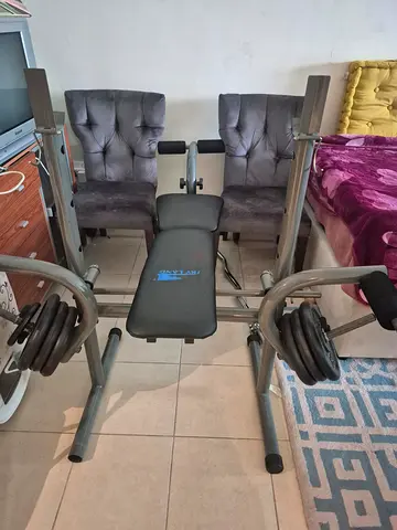 Adjustable home weight bench with barbell and plates