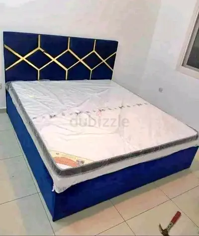 Blue upholstered double bed with mattress - good condition