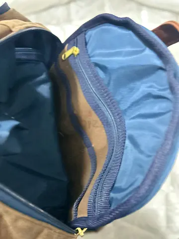 Brand new brown canvas backpack with multiple compartments - good condition