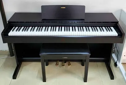 The Yamaha YDP-103R (Rosewood finish) is an entry-level console digital piano from the Arius series.