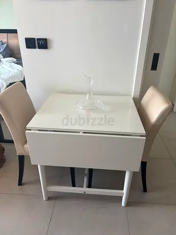 White compact dining with drawer - good condition. Only one chair worn out but still usable