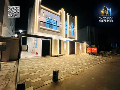 Modern 6-bedroom villa with a roof terrace, including registration fees, in Al Helio 2, Ajman. Freehold ownership with bank financing available.