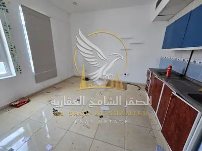 The best studio in Al Qulayaah, Sharjah with central AC and central gas, spacious area, for annual rent.
