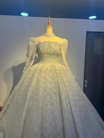 White embroidered long-sleeve ball gown wedding dress (display mannequin)