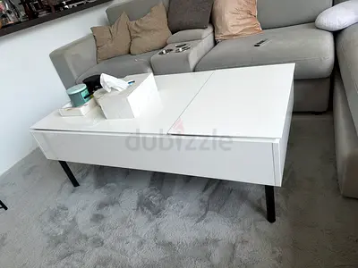 White modern lift-top coffee table with storage, good condition