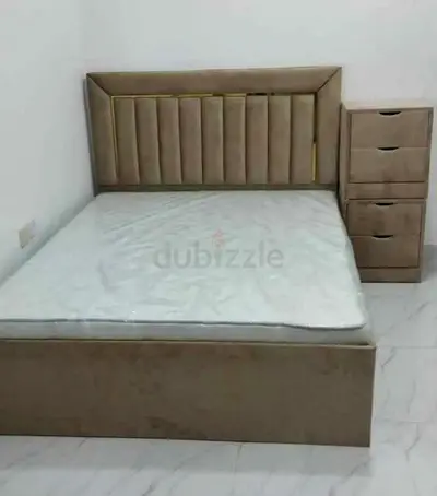 New Beige upholstered Queen bed with matching bedside drawers