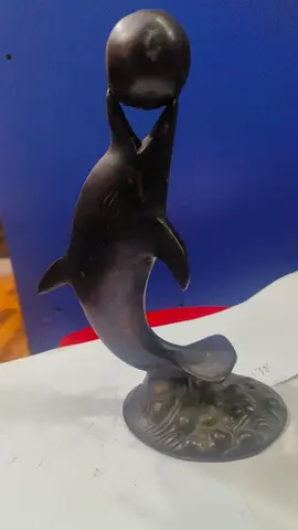 Bronze dolphin figurine holding a ball - 15x20cm