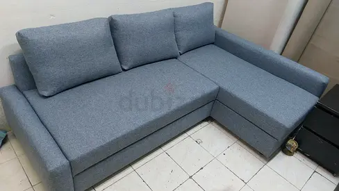 L-shaped grey fabric sofa with chaise, good condition