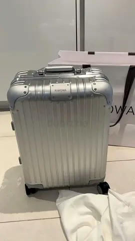 Silver Rimowa carry-on suitcase - good condition