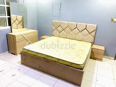 Beige upholstered double bed with mattress, dresser and nightstands - good condition