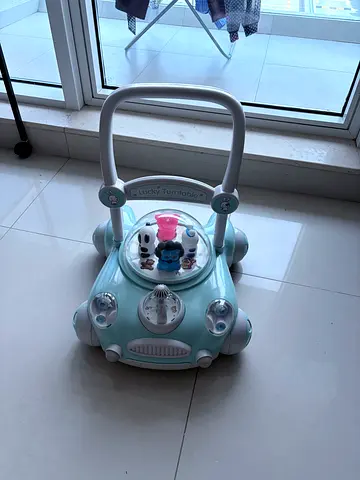 Lightweight baby activity walker with spinning toys - good condition