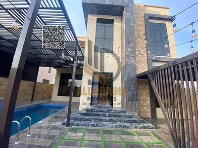 فرصة مميزة للإيجار في العالية – عجمان | فيلا مفروشة مع ملحق وحمام سباحة مغطى | 4 غرف ماستر | 3,600 قدم بناء