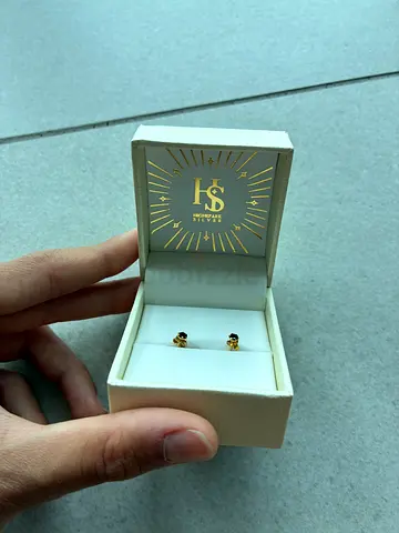 Small Black Stone with a gold plated silver metal