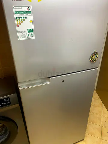 Silver top-freezer refrigerator - good working condition