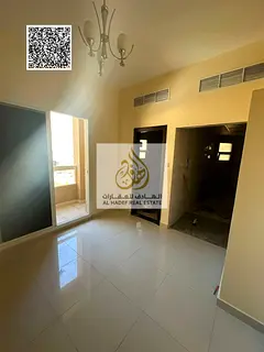 Studio apartment with balcony and separate kitchen for annual rent in Al Rawda area, Ajman