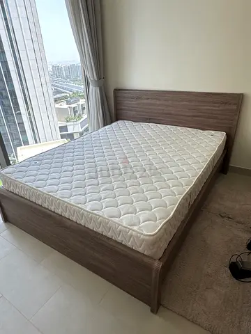 Queen bed frame with mattress - light wood finish, excellent condition. Barely used