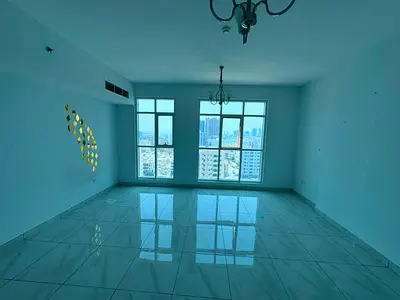 A two-bedroom apartment with a living room, second occupancy, on Ajman Corniche, with views of the creek and city, for 45,000 AED payable in four inst