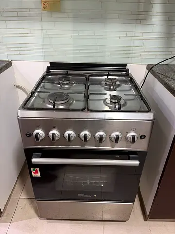 Used stainless steel 4-burner gas cooker with oven - good condition