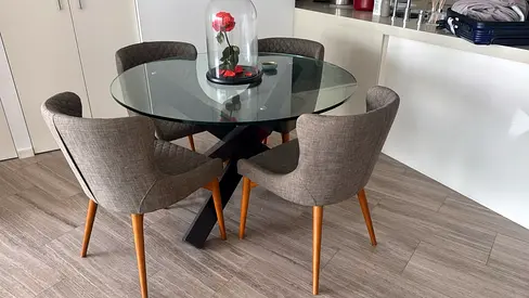 Glass round dining table with 4 upholstered chairs - good condition