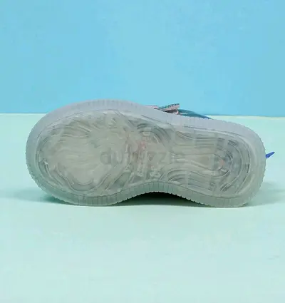 Light blue sneakers with translucent sole — single pair
