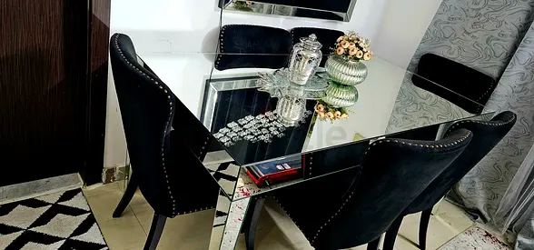Mirrored Top Dining Table with 6 Black Upholstered Chairs - Good Condition