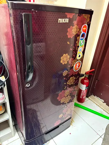 Nikai single-door refrigerator with floral design - good condition