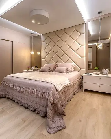 Queen upholstered bed with padded headboard in beige