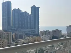 A spacious one-bedroom apartment in the second row from Ajman Corniche, with a sea view.