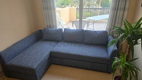 L-shaped blue fabric sofa - good condition