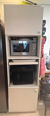Tall white kitchen cabinet for microwave and oven storage