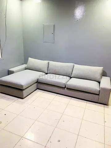 Light grey L-shaped 4-seater sofa with chaise lounge