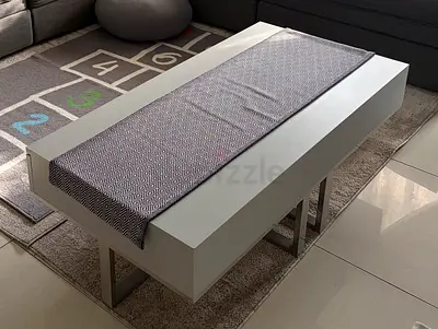 Modern white rectangular coffee table with lower shelf