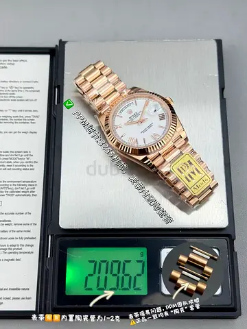 This Rolex Day-Date 40 in 18 ct Everose gold features a white dial and a fluted bezel.