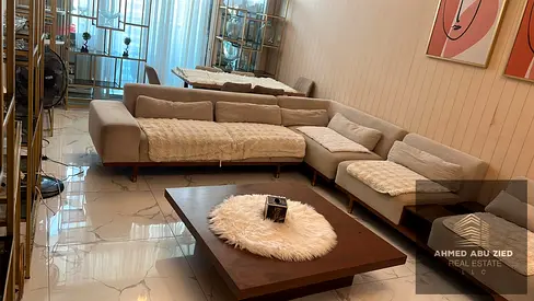 Two bedrooms and a living room for annual rent in Al Waha Towers, Ajman. Features include three bathrooms, a balcony, parking, gym access, and a swimm