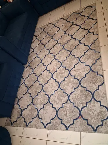 Used modern geometric area rug - gray with navy pattern, good condition