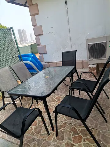 Pan Home- Outdoor glass-top dining table with 6 mesh chairs - used