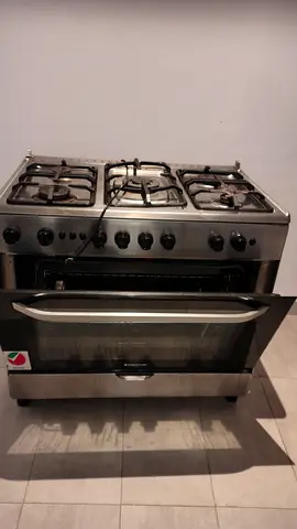 Used stainless steel 5-burner gas cooker with oven