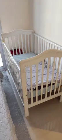 White Wooden Baby Crib with Mattress in Usable Condition