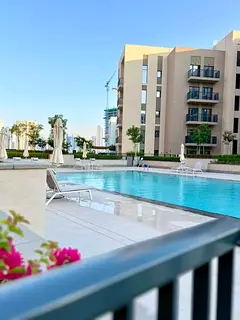 For monthly rent: One bedroom and living room with balcony overlooking the swimming pool in Sharjah,