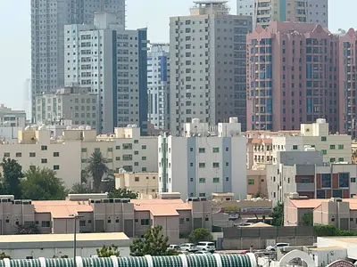 Two-bedroom apartment with a living room in Al Nuaimiya 1. Fully lit, balcony, two bathrooms, central air conditioning, and maintenance included by th