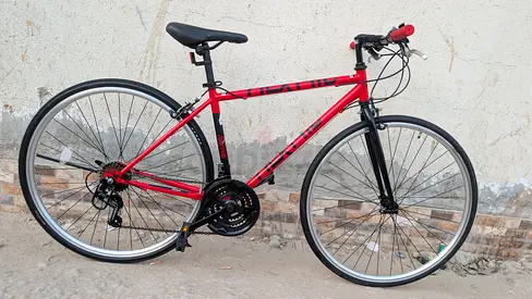 Red hybrid/road bike - 21 speed, good condition