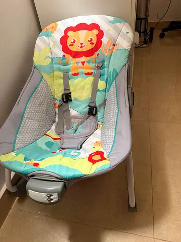 Baby bouncer seat / rocker with colorful lion print - good condition