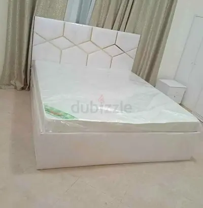 New White upholstered Queen Size bed with mattress and headboard
