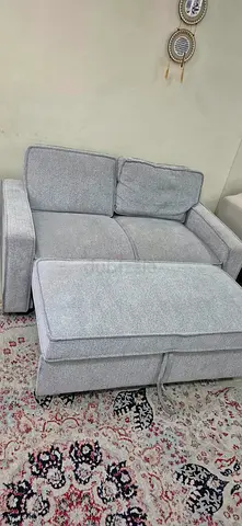 Light grey 2-seater sofa with ottoman - good condition